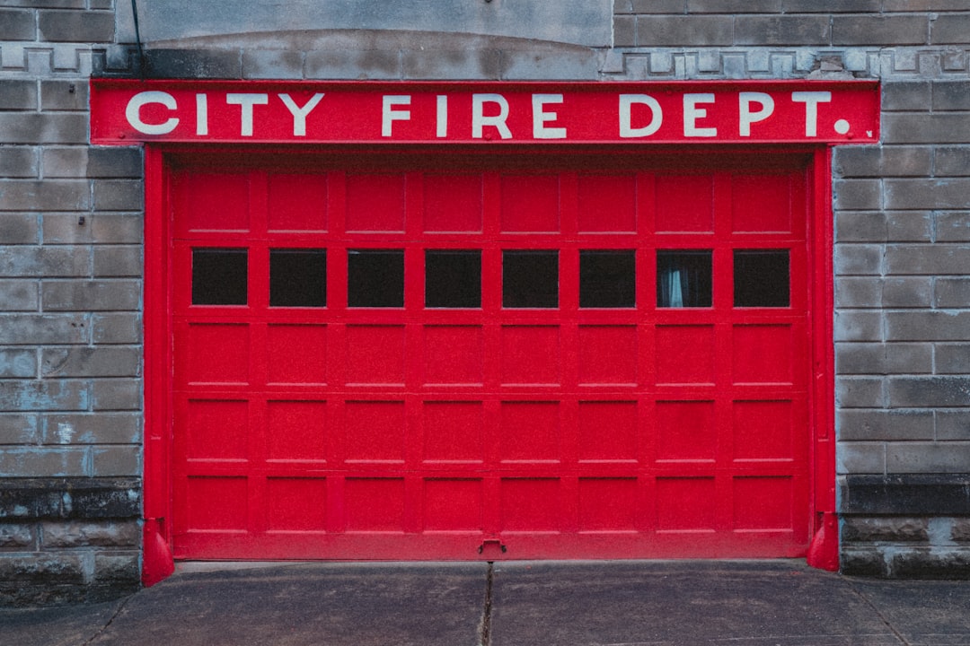 A red fire station door and its entrance.