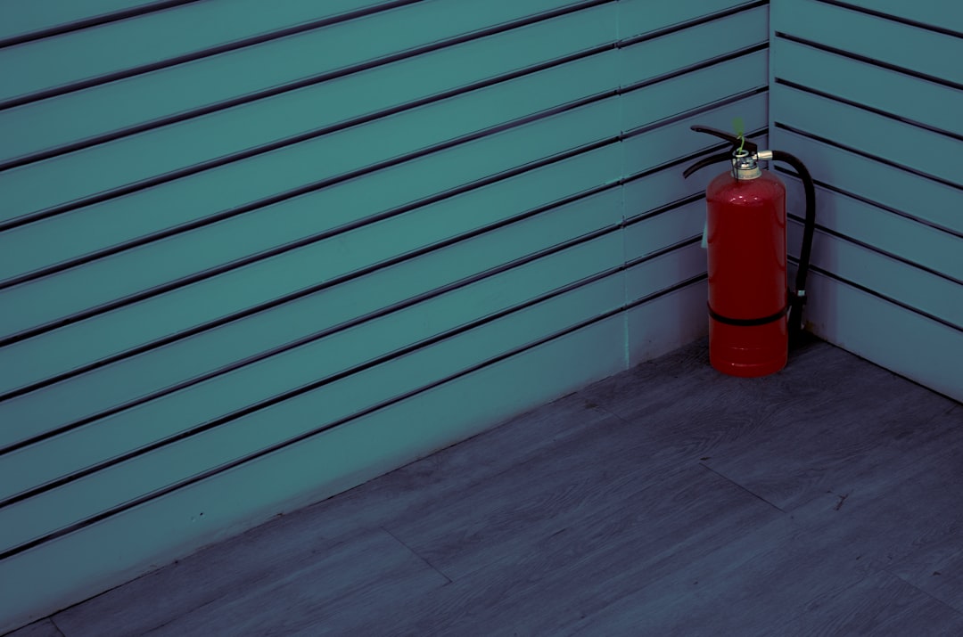 Red fire extinguisher in a corner