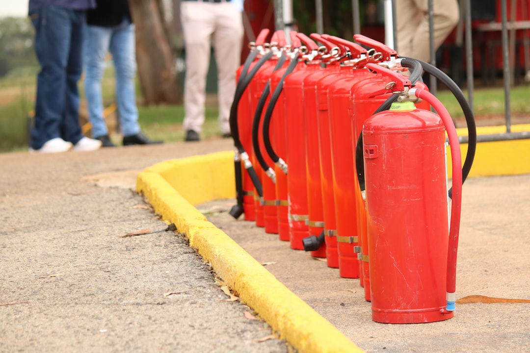 A line of red fire extinguishers stands ready.